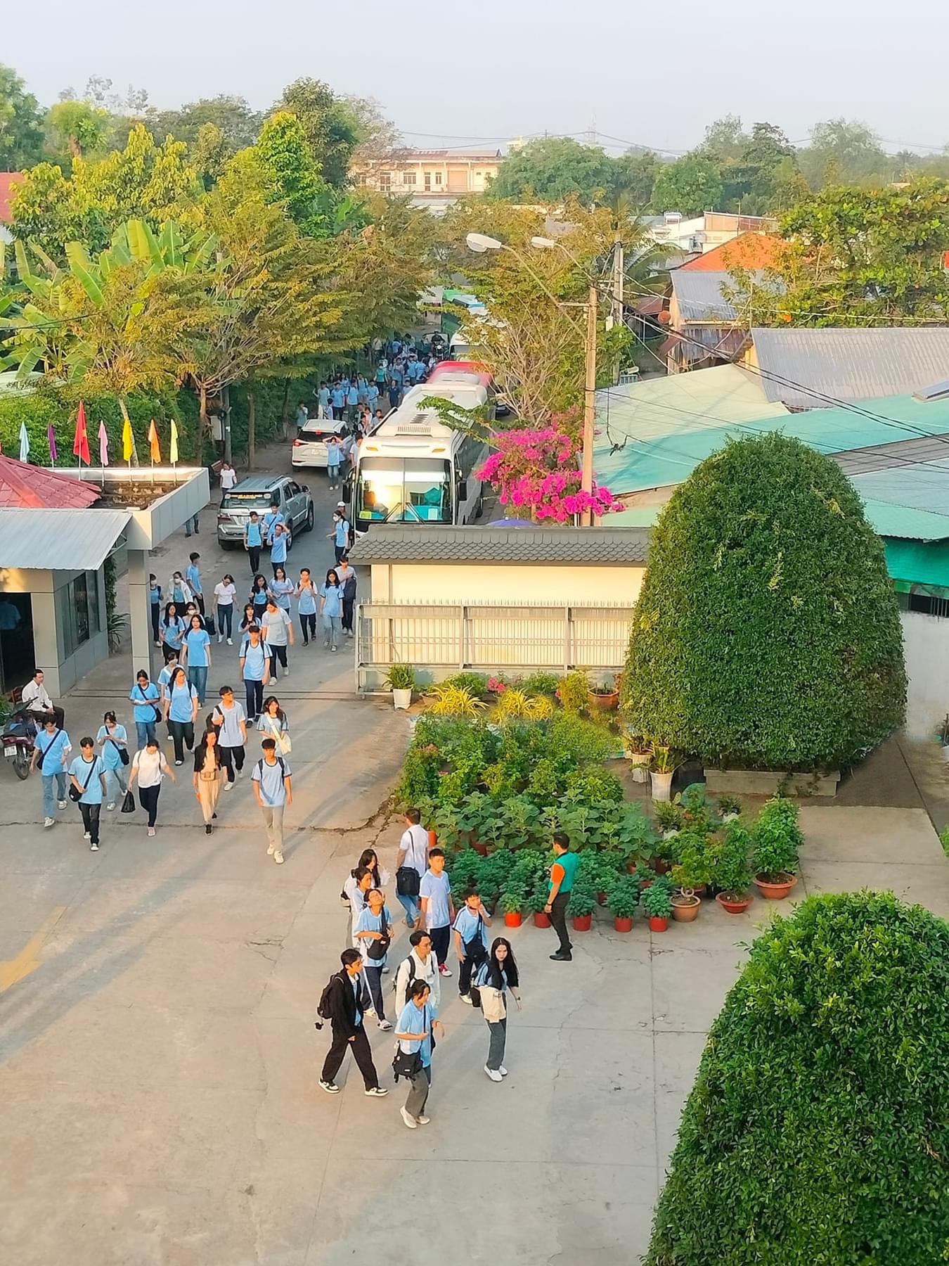 A group of people walking down a streetDescription automatically generated